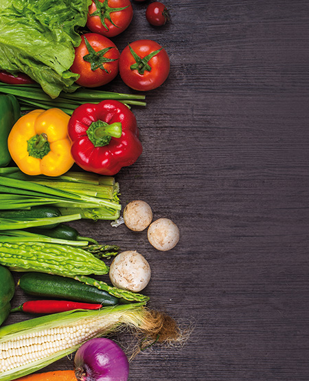 studio photography of different fruits and vegetables on old wooden table