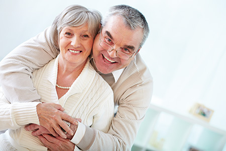 Portrait of a happy senior couple looking at camera